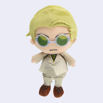 Plush doll of Nanami from Jujutsu Kaisen with blonde hair, green lensed glasses and a tan suit. 