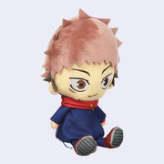 Small plush of Itadori Yuji from Jujutsu Kaisen, sitting on the ground with spiky hair and a slight smile.