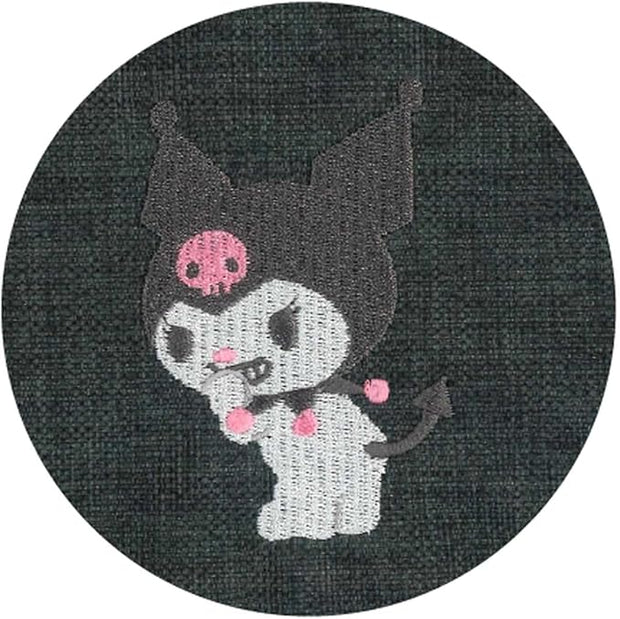 Close up of embroidery of Kuromi looking over her shoulder and snickering.