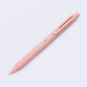 Coral pink bodied mechanical pencil, with a matching color cap over the eraser and a clip for attaching to a pocket or piece of paper.