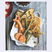 Photograph of a plate of tempura vegetables and some shrimp. 