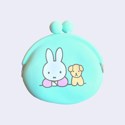 Mint green silicone coin pouch with an illustration of Miffy sitting with her arms crossed and a yellow dog sitting next to her.