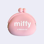 Backside of light pink silicone coin pouch with Miffy written in all lowercase white font.