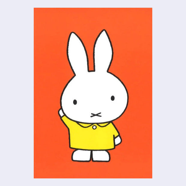 Bright orange postcard with an illustration of Miffy wearing a collared yellow dress and raising one arm into the air.