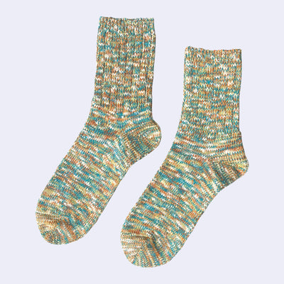 Cotton crew socks thickly knit with green, orange, blue and white thread. Each color is mixed.