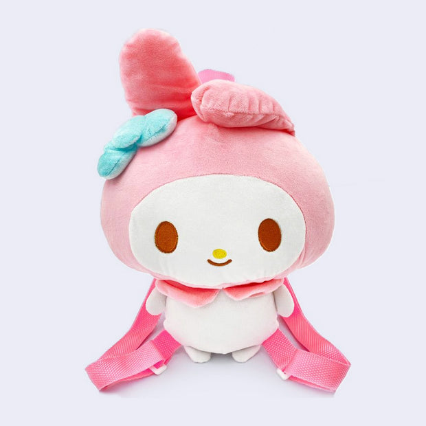 Plush doll of My Melody, made into a backpack with a zip top and adjustable pink straps. Her facial features are embroidered on and she has floppy ears and a blue bow.