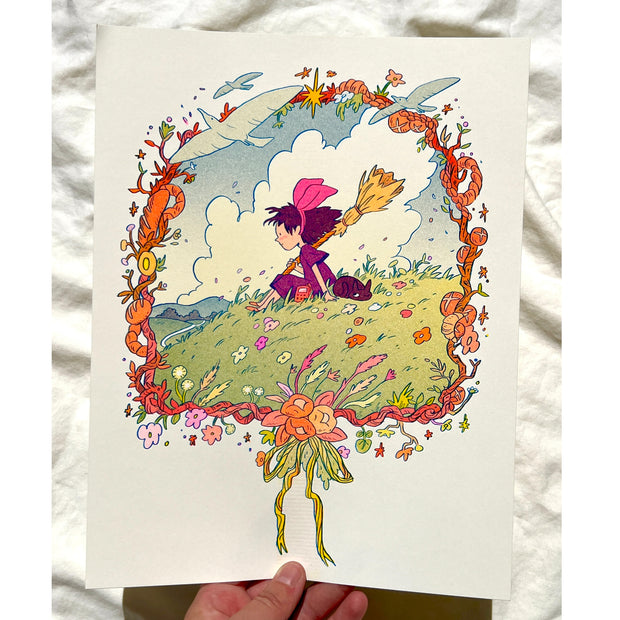 Risograph print of Kiki from Kiki's Delivery Service sitting on a green hilltop with a cloudy blue sky behind. She holds a broom and has a hand radio, with a black cat laying beside her. Scene is framed by a wreath made of bread, flowers and birds.