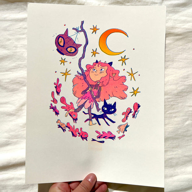 Risograph print of a girl with dense pink hair and small purple horns. She holds a lantern on a twig shaped like a cat's head. A black cat runs alongside her and pink fish swim below her.