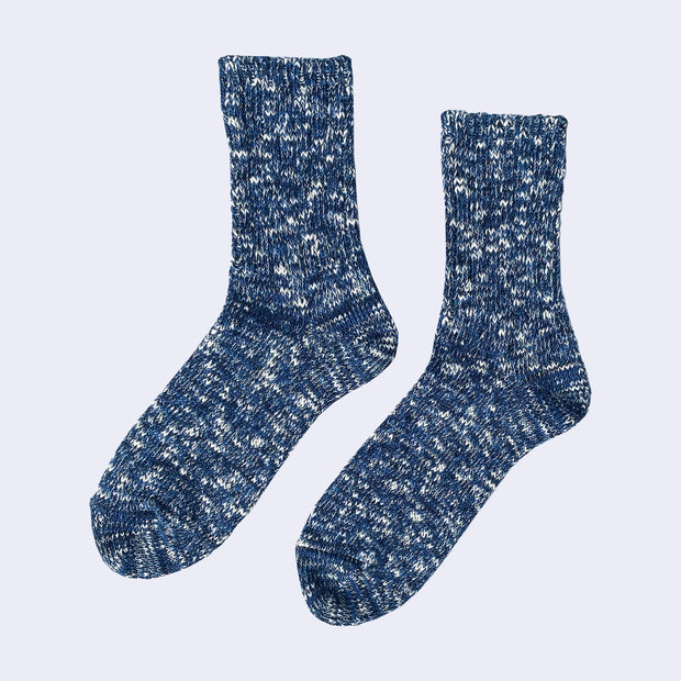 Cotton crew socks thickly knit with navy blue and white thread. Each color is mixed.