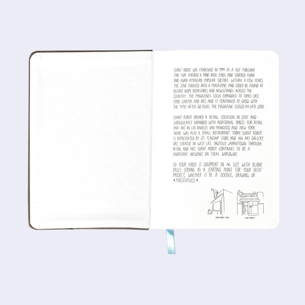 Open book spread showing the front inner cover, with cream colored pages and a written letter about the history of Giant Robot on the first page.