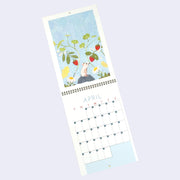 Spiral bound calendar for the month of April, with one page being a full bleed illustration and the other having space for writing in each day. Illustration is light blue with a small mouse standing on a rock and reaching towards growing strawberry plants.