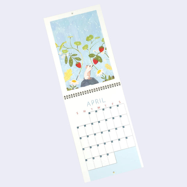 Spiral bound calendar for the month of April, with one page being a full bleed illustration and the other having space for writing in each day. Illustration is light blue with a small mouse standing on a rock and reaching towards growing strawberry plants.