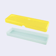 Yellow translucent pencil case with a mint green colored bottom.