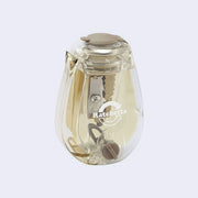 Clear pencil sharpener with an ivory colored interior.