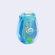 Clear pencil sharpener with a blue and green colored interior.