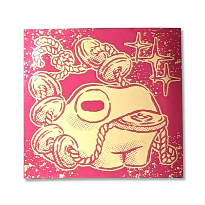 Gold ink sticker on red backing of a frog holding a string of coins in its mouth.