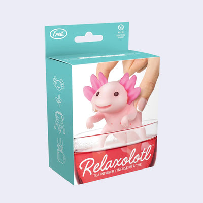 Product packaging for an axolotl shaped tea infuser, with a pink body and a smiling happy face. Box has "Relaxolotl" written in cursive and "tea infuser" underneath.