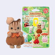 Small flocked figure of a baby chipmunk, dressed in an acorn plush outfit and with a hard acorn hat to the left.