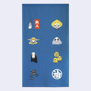 Blue rectangular tapestry with 8 icon style graphics of Spirited Away characters and symbols recognizable from the movie.