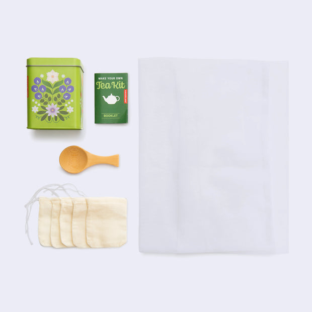 Kit for making your own tea, includes reusable tea bags, a spoon, cloth and written guide.