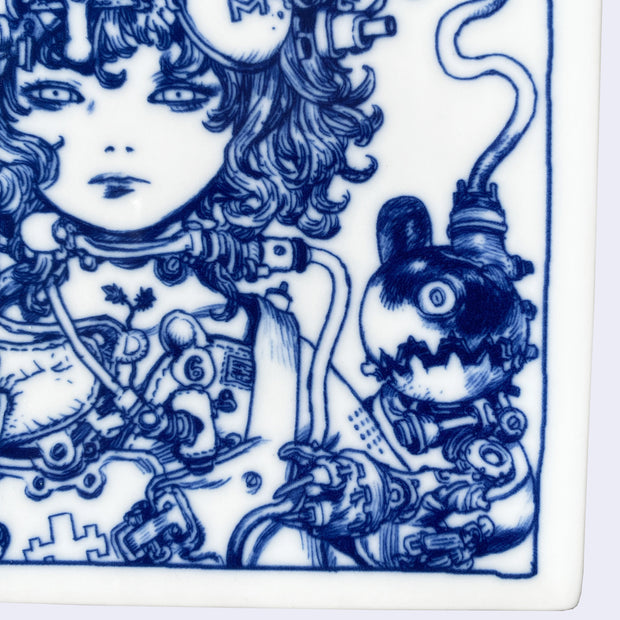 Square white porcelain plate with rounded edges and dark blue line art illustration of a girl with short, wavy hair. She wears a large helmet with many robotic elements and wires. A bird peaks out the top and smaller robotic elements are coming off her body. Close up.