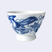 White ceramic bowl with a large rounded base that extends out slightly. A dark blue line illustration of a bird is on the bowl, its tail is long and a wire or branch comes from below its wing.