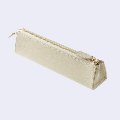 Warm white synthetic leather exterior pen case, in a triangular shape with a zipper top.