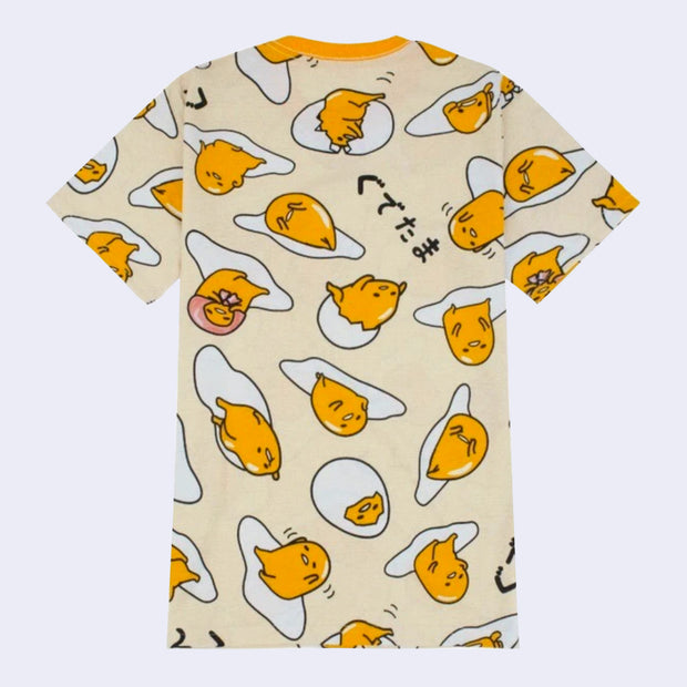 Yellow t-shirt with a repeating all over pattern of Gudetama, sitting on egg yolk, inside of an egg shell or wrapped in bacon.