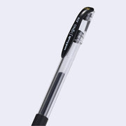 Clear bodied black ink pen with a rubber grip and writing on the pen cap that reads "uni-ball signo DX"