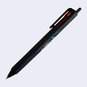 Black ballpoint click pen with 3 ink colors: the main click is black, and 2 side sliding clicks are blue and red.