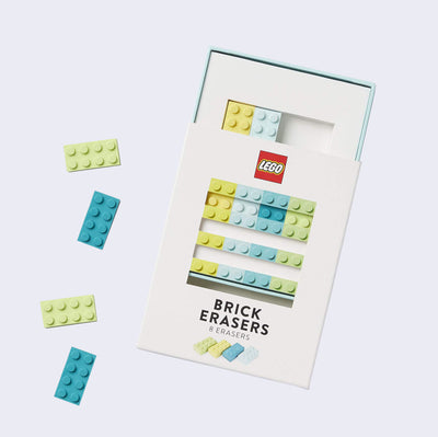 Set of erasers shaped and textured like Lego blocks, mostly pastel in coloring: blues, greens and yellow.