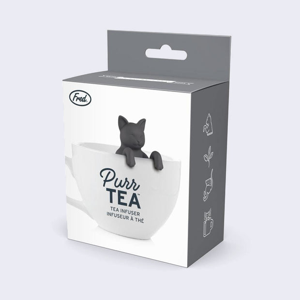 Product packaging, featuring a photo of a gray cat within a white mug filled with tea. "Purr Tea Tea Infuser" is written on the packaging.