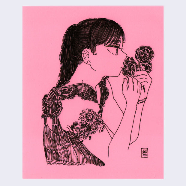 Ink drawing on pink paper of a woman's bust, facing to the right. She has a floral tattoo that wraps around her bicep and holds flowers up to her nose.