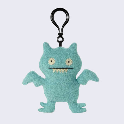 Keychain of Ice Bat Uglydoll, light blue and textured fabric.