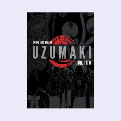 "Uzumaki" book cover, a black cover with a negative photo effect of illustrations of a group of uniformed figures. 