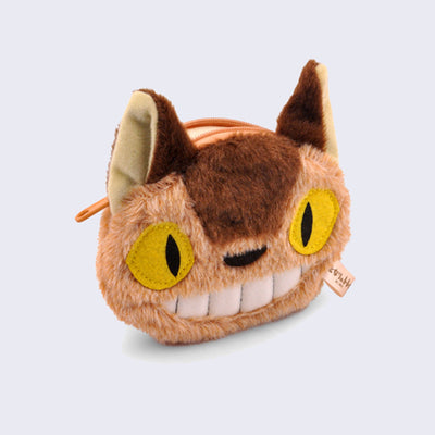 Fluffy coin pouch shaped as the face of Catbus from My Neighbor Totoro, with sewn on yellow eyes and a wide smile.