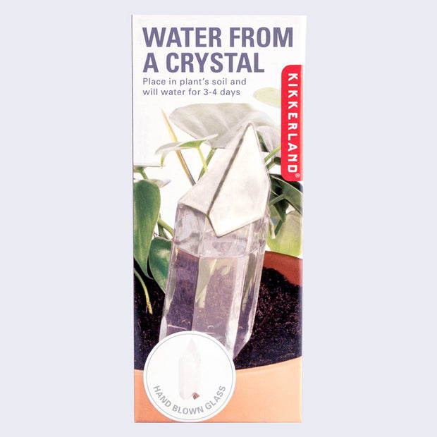 Product packaging for Water From a Crystal, a crystal shaped glass container that you fill with water and place in a potted plant to self water over the course of 3-4 days. 