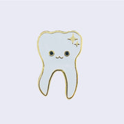 Enamel pin of an illustrated smiling white tooth with gold sparkles in the top right corner and a gold outline.