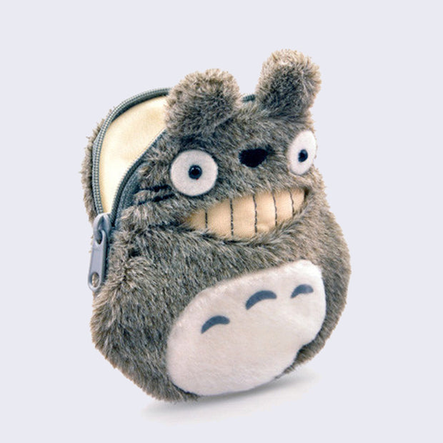 Plush coin pouch with a zipper top, designed to look like Totoro from My Neighbor Totoro with a wide smile and oval shaped body.